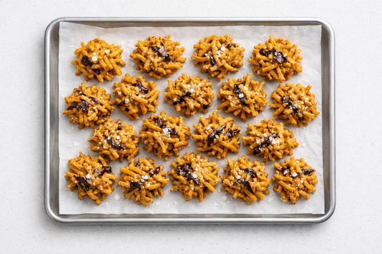 Christmas haystacks cookies on parchment, golden butterscotch chow mein noodle clusters